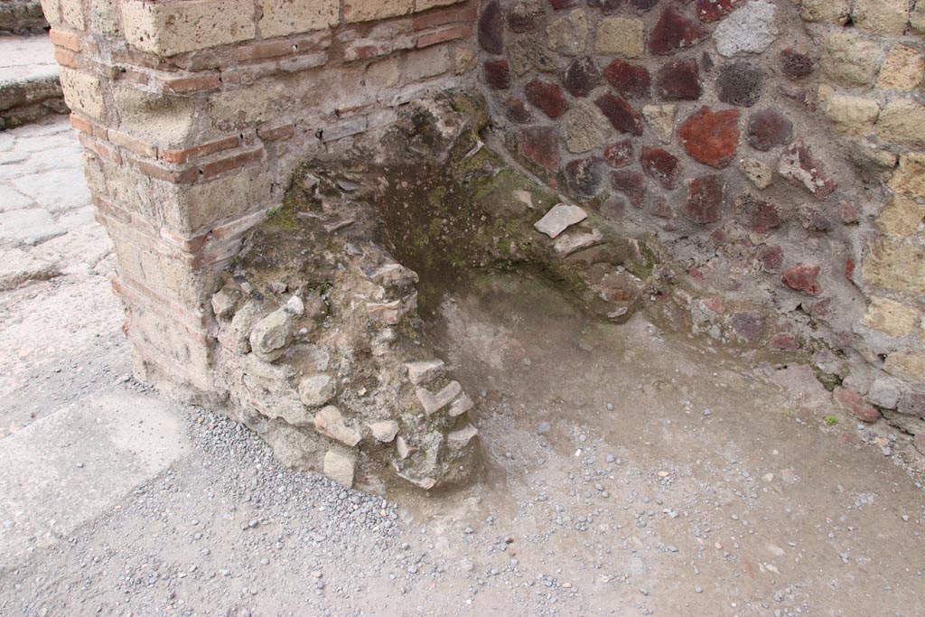 II.6 Herculaneum. May 2024. Remains in south-east corner, south of entrance doorway. Photo courtesy of Klaus Heese.